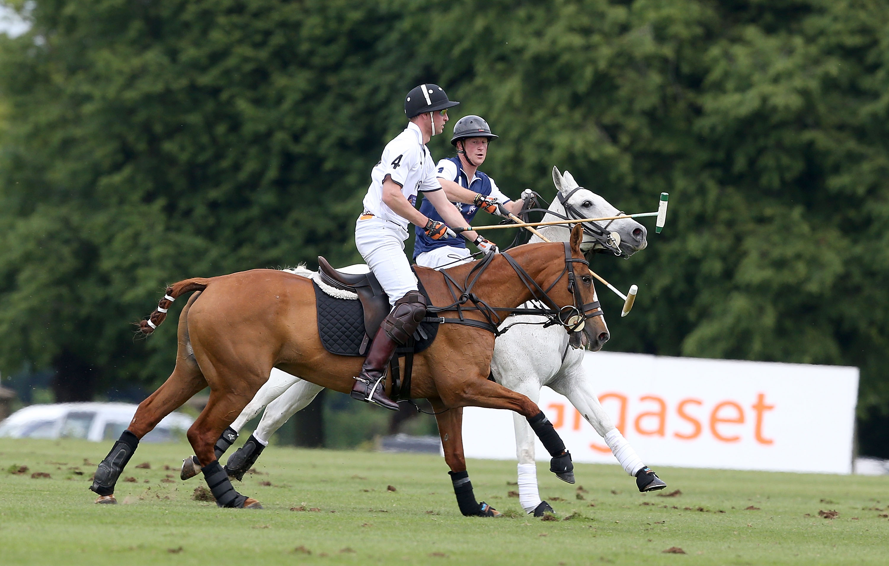 TETBURY, ENGLAND - JUNE 14: Prince Harry plays for team Royal Salute and Prince William, Duke of Cambridge plays for team Piaget at the Gigaset Charity Polo Match at Beaufort Polo Club on June 14, 2015 in Tetbury, England. (Photo by Chris Jackson/Getty Images for Gigaset Mobile) *** Local Caption *** Prince Harry; Prince William; Duke of Cambridge