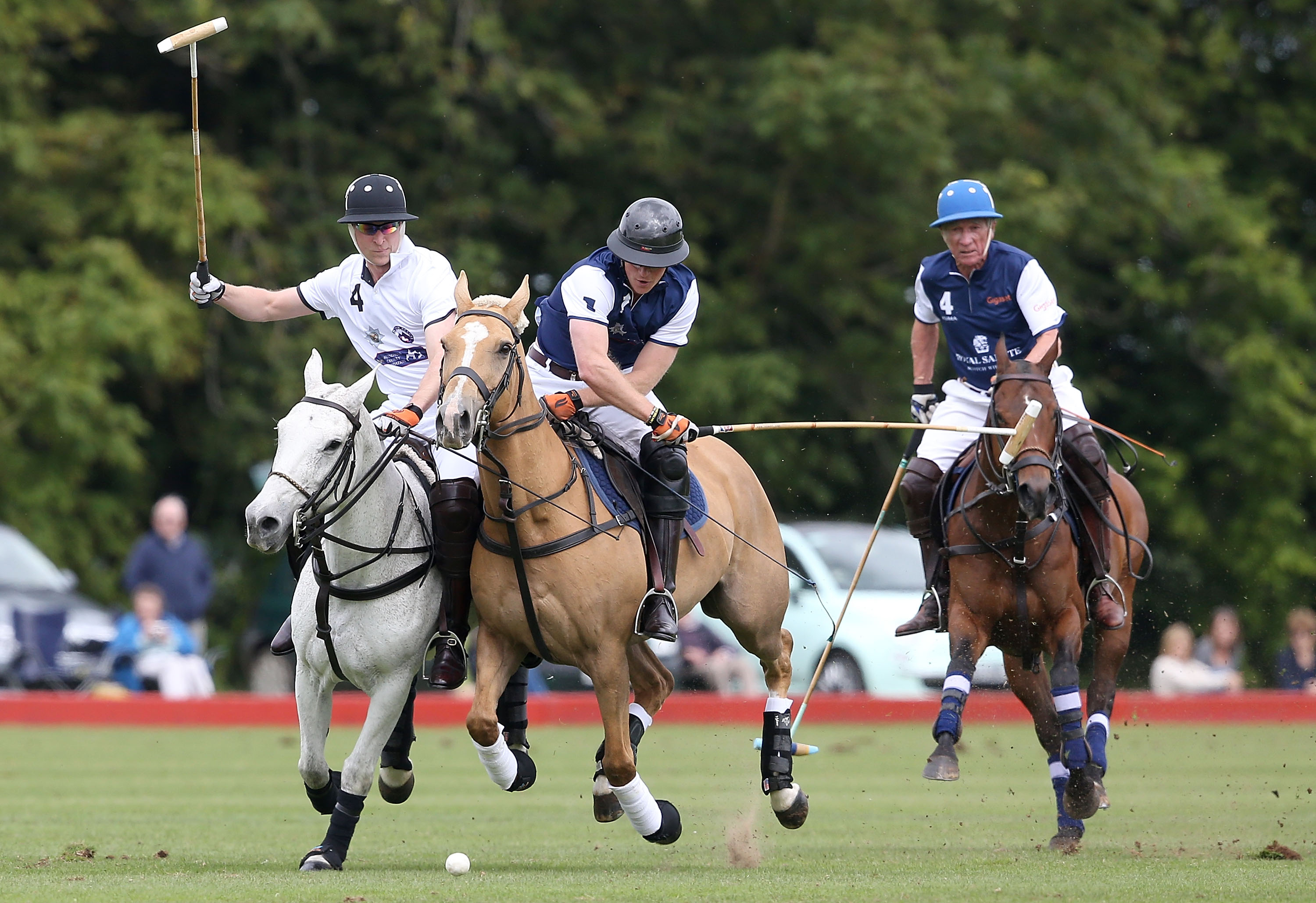 TETBURY, ENGLAND - JUNE 14: Prince Harry plays for team Royal Salute and Prince William, Duke of Cambridge plays for team Piaget at the Gigaset Charity Polo Match at Beaufort Polo Club on June 14, 2015 in Tetbury, England. (Photo by Chris Jackson/Getty Images for Gigaset Mobile) *** Local Caption *** Prince Harry; Prince William; Duke of Cambridge