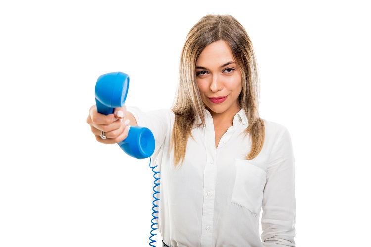 Beautiful business woman handing blue telephone receiver on white background with copy space advertising area